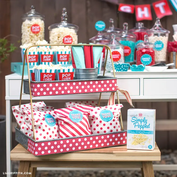 Popcorn bar and gift bags set up as a part of birthday party ideas